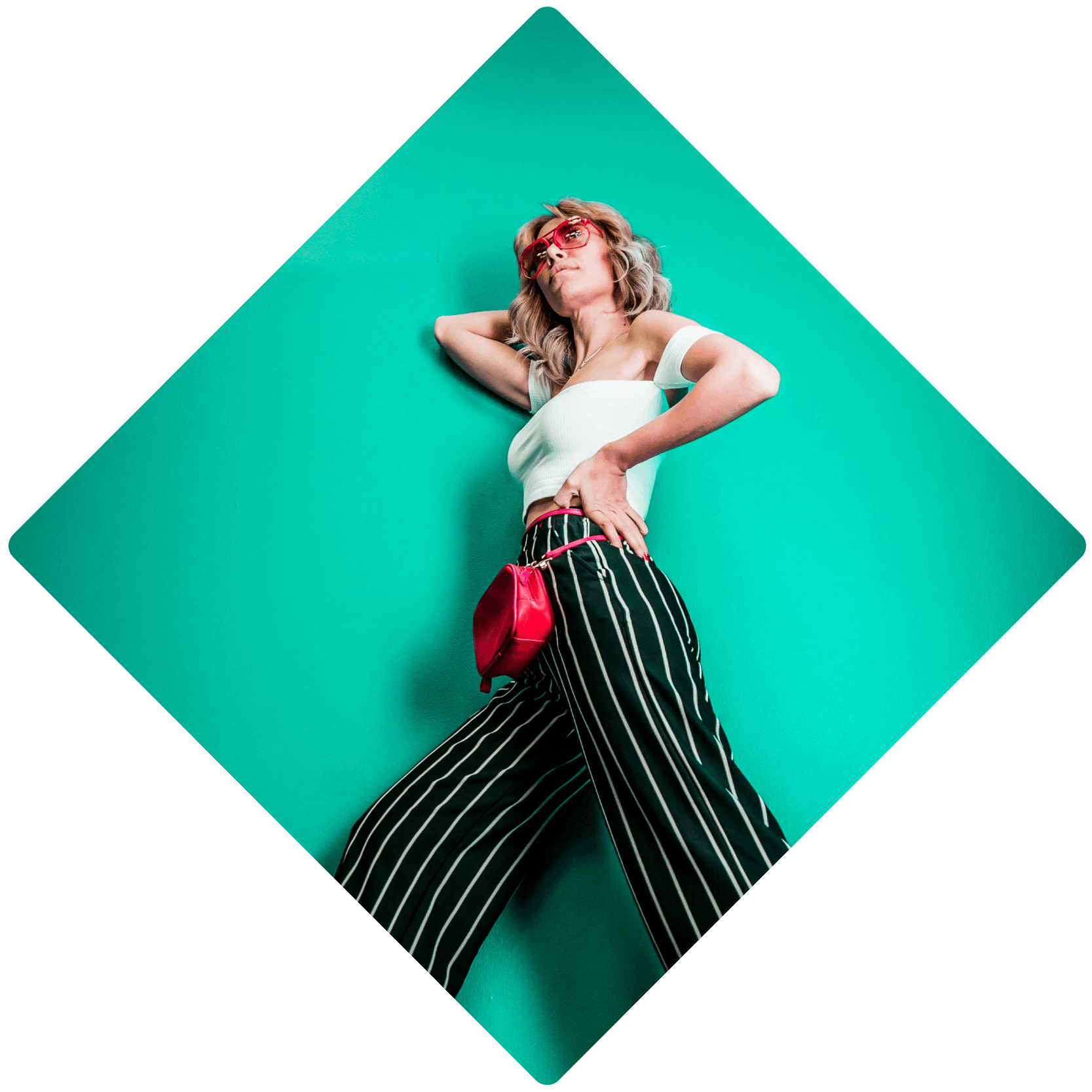 a woman in a white top and black and white striped pants